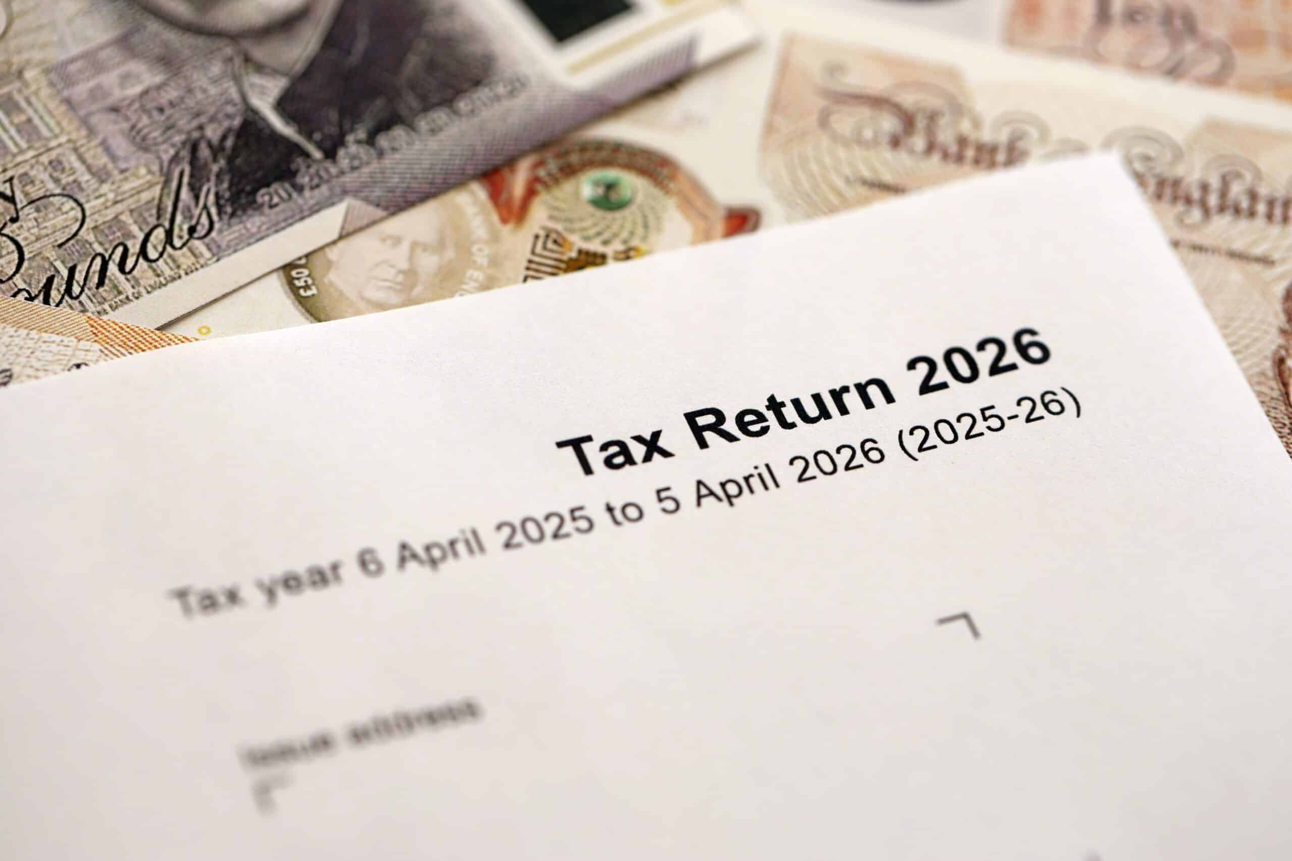 Self assessment tax return form for the 2025 to 2026 tax year with banknotes