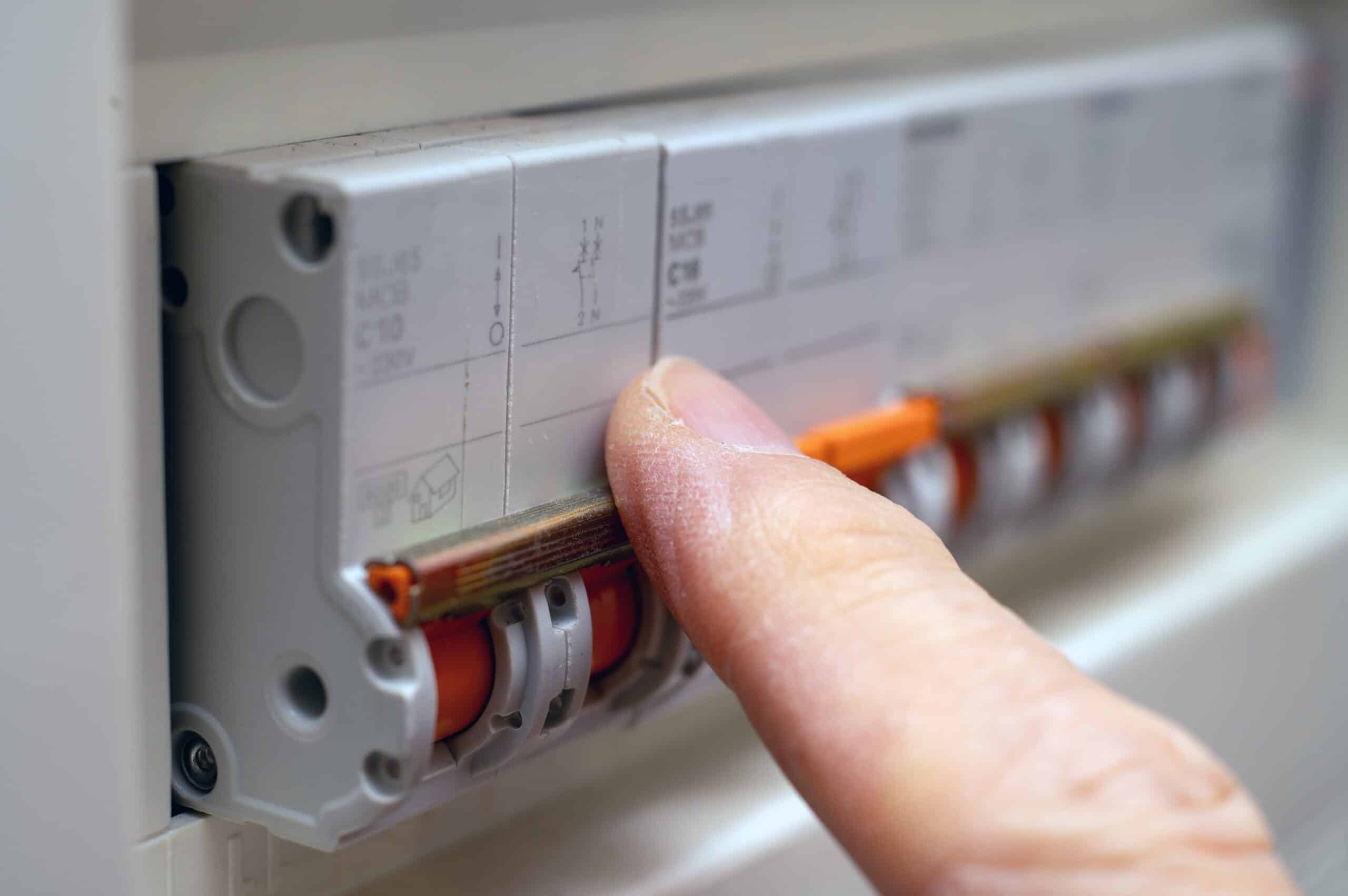Finger switching a breaker in a consumer unit