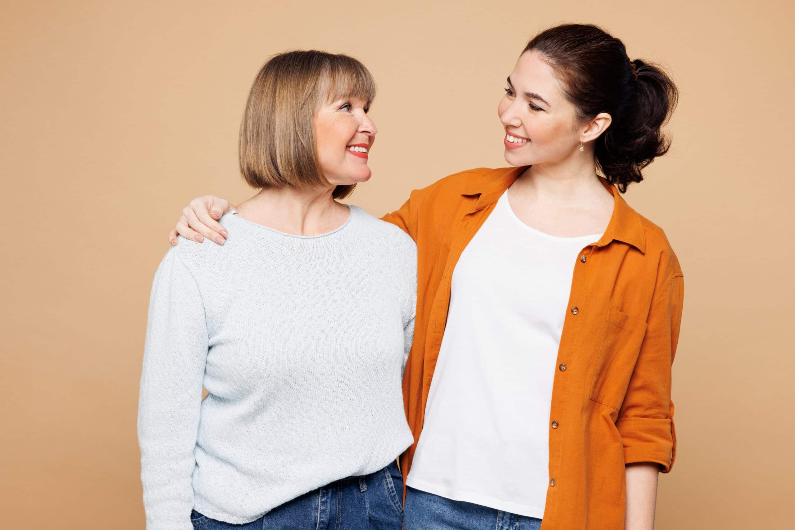 Two women standing together smiling
